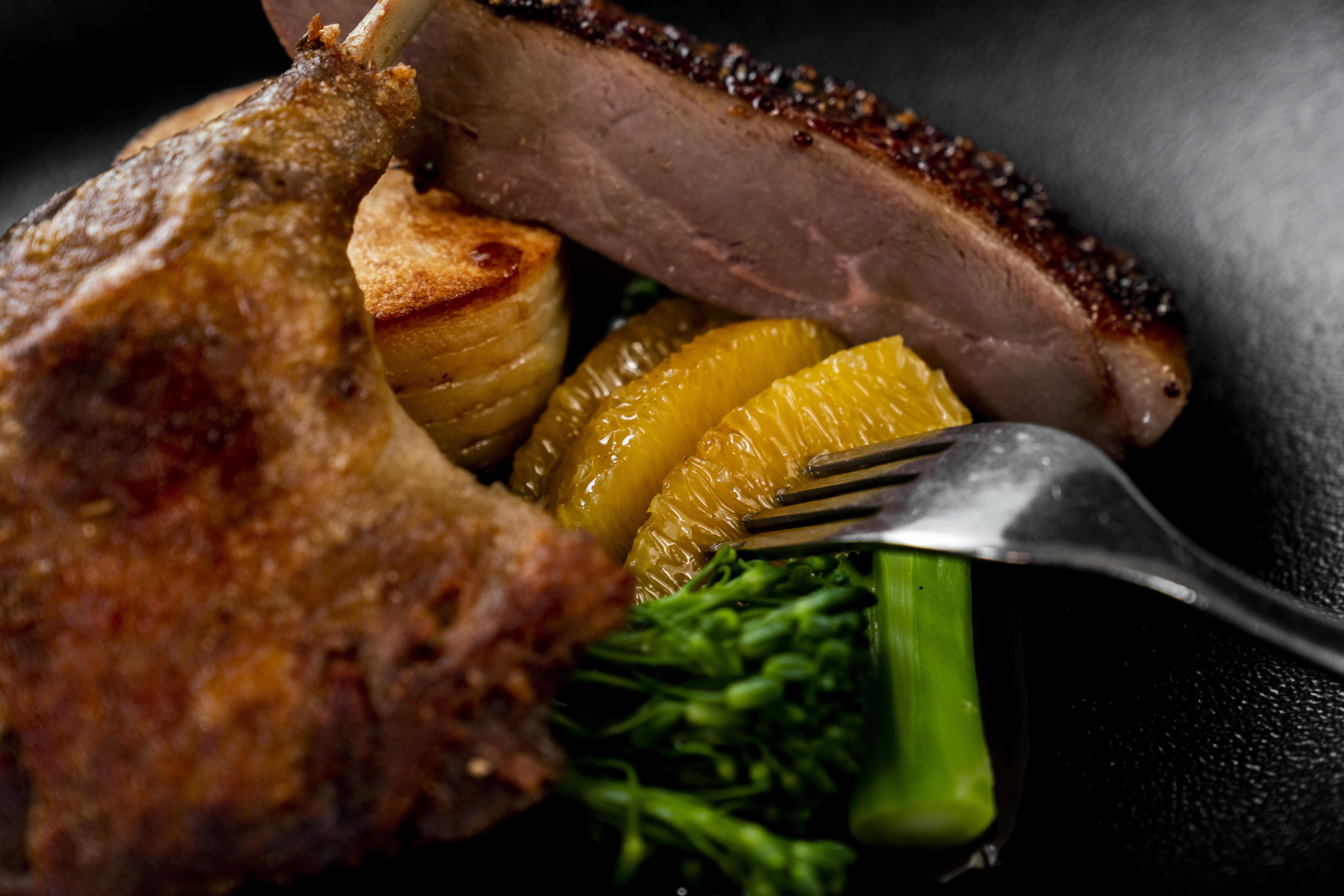 The Point Brisbane Hotel Dış mekan fotoğraf A duck confit with orange and vegetables