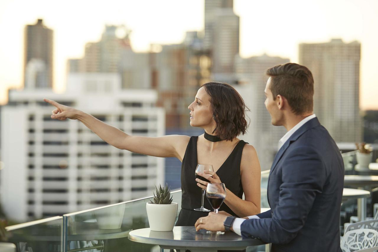 The Point Brisbane Hotel Dış mekan fotoğraf A couple at a rooftop party